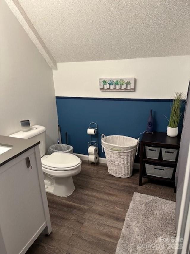 1273 Wateree Estates Rd, Winnsboro, SC 29180 - bathroom featuring toilet, a textured ceiling, wood finished floors, and vanity