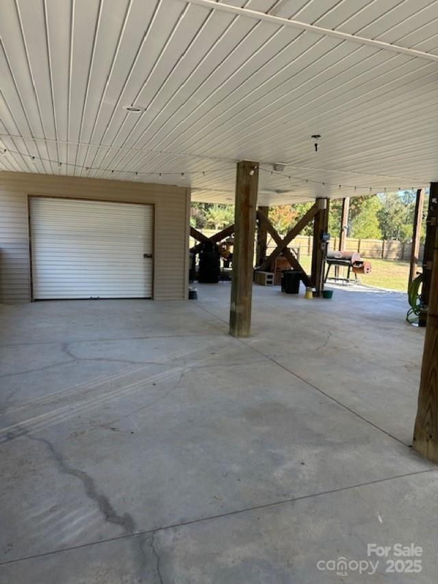1273 Wateree Estates Rd, Winnsboro, SC 29180 - garage with a carport and fence