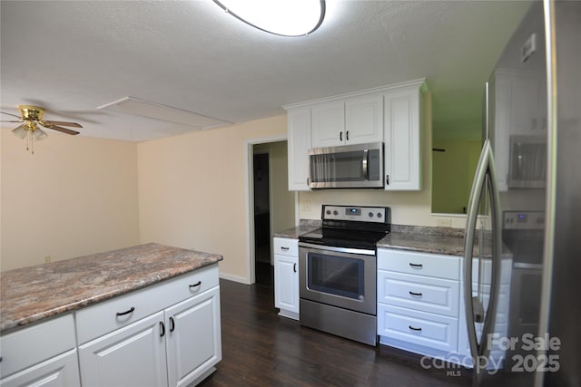 280 Fletcher View Dr, Fletcher, NC 28732 - kitchen featuring stainless steel appliances, dark wood-style floors, ceiling fan, white cabinetry, and baseboards