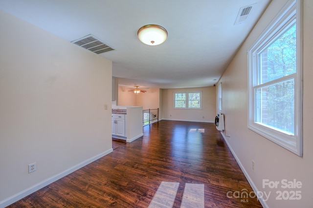 280 Fletcher View Dr, Fletcher, NC 28732 - unfurnished living room with dark wood-style flooring, baseboards, and heating unit