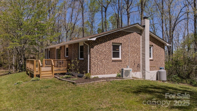 280 Fletcher View Dr, Fletcher, NC 28732 - view of side of property featuring brick siding, a chimney, a deck, and a lawn