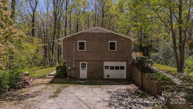 280 Fletcher View Dr, Fletcher, NC 28732 - garage with a view of trees and dirt driveway