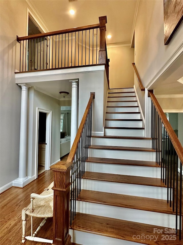 9508 Hayenridge Ct, Huntersville, NC 28078 - stairs featuring crown molding, wood finished floors, and baseboards