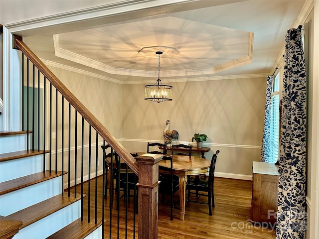 9508 Hayenridge Ct, Huntersville, NC 28078 - dining space with a tray ceiling, ornamental molding, a chandelier, wood finished floors, and stairs