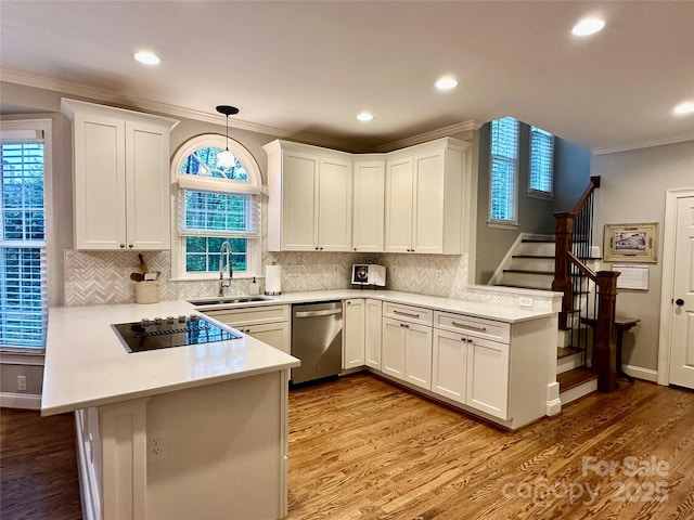 9508 Hayenridge Ct, Huntersville, NC 28078 - kitchen with a peninsula, light countertops, crown molding, black electric cooktop, and dishwasher