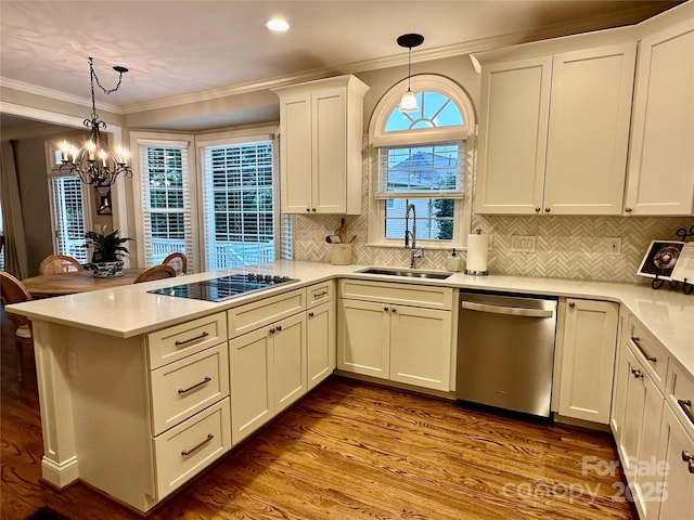 9508 Hayenridge Ct, Huntersville, NC 28078 - kitchen with stainless steel dishwasher, a peninsula, a chandelier, a sink, and black electric cooktop