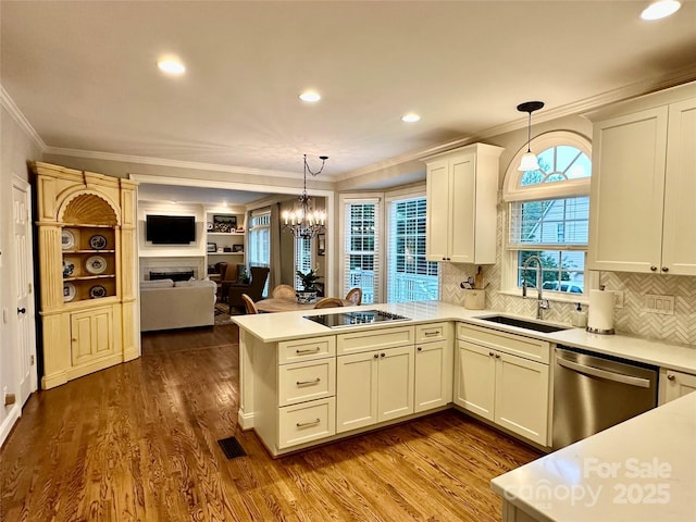 9508 Hayenridge Ct, Huntersville, NC 28078 - kitchen featuring visible vents, dishwasher, a sink, a peninsula, and black electric stovetop