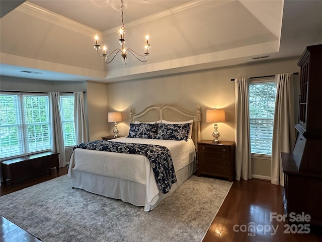 9508 Hayenridge Ct, Huntersville, NC 28078 - bedroom with wood-type flooring, multiple windows, a tray ceiling, and an inviting chandelier