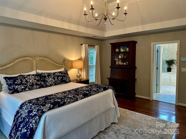 9508 Hayenridge Ct, Huntersville, NC 28078 - bedroom featuring a tray ceiling, baseboards, an inviting chandelier, and wood finished floors