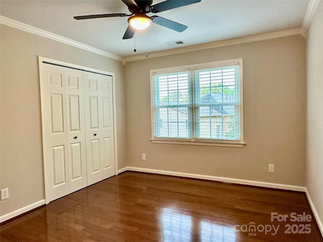 9508 Hayenridge Ct, Huntersville, NC 28078 - unfurnished bedroom featuring crown molding, a closet, visible vents, wood finished floors, and baseboards