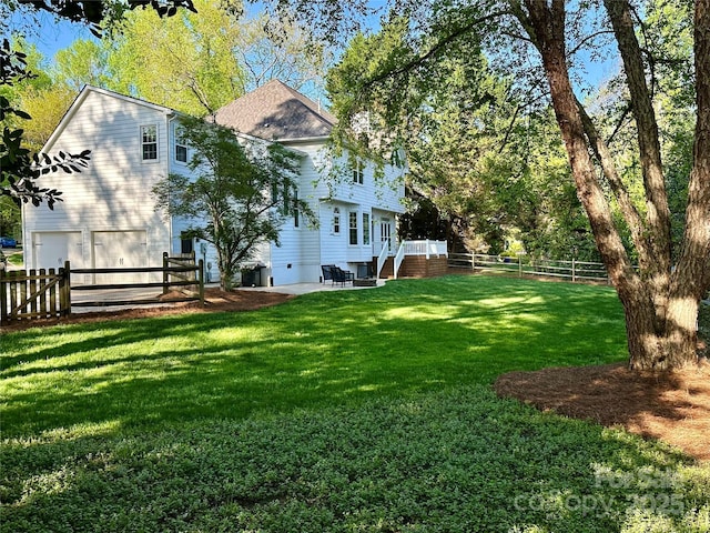 9508 Hayenridge Ct, Huntersville, NC 28078 - view of yard featuring a fenced backyard, a patio, and a garage