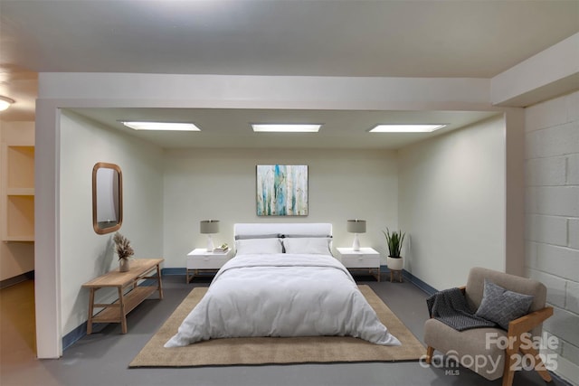 1473 12th Street Dr NW, Hickory, NC 28601 - bedroom with concrete block wall and concrete floors
