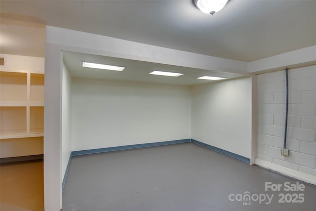 1473 12th Street Dr NW, Hickory, NC 28601 - empty room featuring baseboards, visible vents, finished concrete floors, and concrete block wall