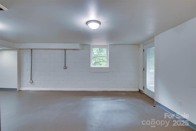 1473 12th Street Dr NW, Hickory, NC 28601 - empty room featuring finished concrete floors and concrete block wall