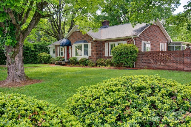 1473 12th Street Dr NW, Hickory, NC 28601 - single story home with a chimney, a front yard, and brick siding