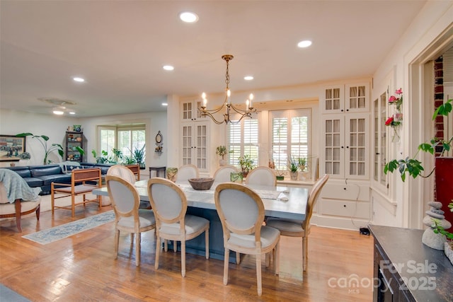 1473 12th Street Dr NW, Hickory, NC 28601 - dining room featuring recessed lighting, a notable chandelier, french doors, and light wood-style floors