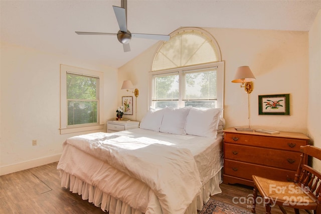 1473 12th Street Dr NW, Hickory, NC 28601 - bedroom with baseboards, a ceiling fan, vaulted ceiling, and dark wood-style floors
