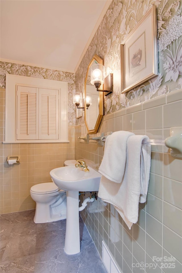 1473 12th Street Dr NW, Hickory, NC 28601 - half bathroom with toilet, tile walls, wallpapered walls, and a wainscoted wall