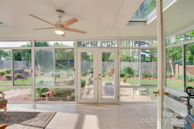 1473 12th Street Dr NW, Hickory, NC 28601 - unfurnished sunroom featuring a skylight, ceiling fan, and french doors