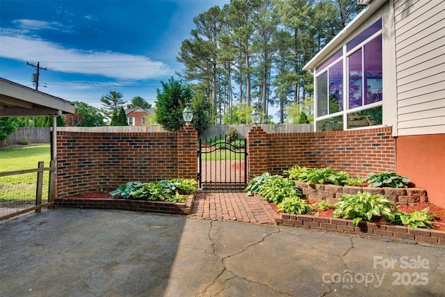 1473 12th Street Dr NW, Hickory, NC 28601 - view of yard featuring fence, a gate, and a patio