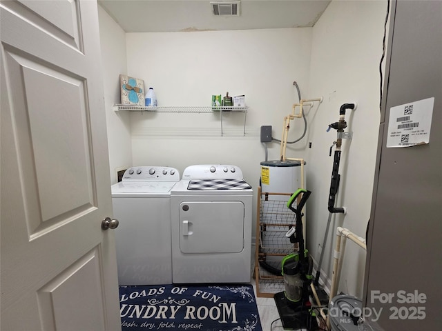 laundry area with washer and dryer, laundry area, and visible vents