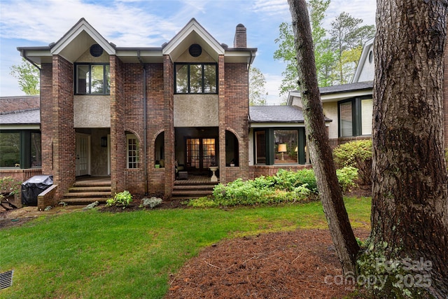 11 Bourne Ln, Asheville, NC 28803 - view of front of property featuring a chimney, a porch, brick siding, french doors, and a front lawn