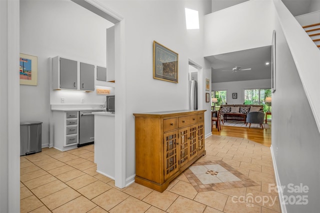 8 Hunting Country Trl, Tryon, NC 28782 - corridor with a high ceiling, light tile patterned flooring, and baseboards