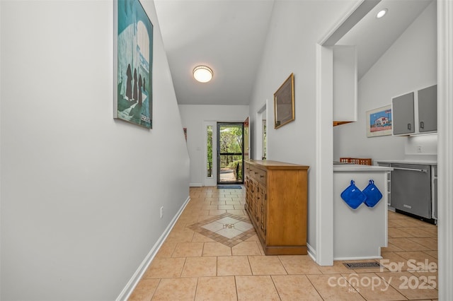 8 Hunting Country Trl, Tryon, NC 28782 - hall with visible vents, baseboards, vaulted ceiling, and light tile patterned flooring