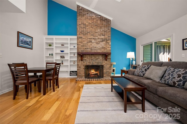 8 Hunting Country Trl, Tryon, NC 28782 - living area featuring high vaulted ceiling, a fireplace, and wood finished floors