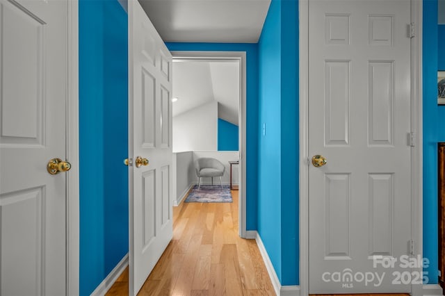 8 Hunting Country Trl, Tryon, NC 28782 - hall featuring light wood finished floors, baseboards, and vaulted ceiling