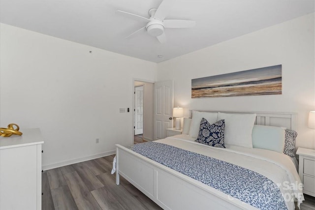 bedroom with dark wood-style floors, baseboards, and ceiling fan