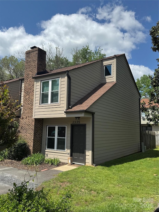 2335 Brookview Ct, Rock Hill, SC 29732 - view of front facade featuring a front lawn, fence, and a chimney