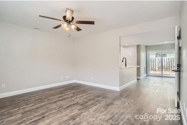 2335 Brookview Ct, Rock Hill, SC 29732 - empty room with a ceiling fan, dark wood-style floors, and baseboards