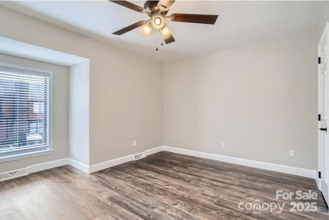 2335 Brookview Ct, Rock Hill, SC 29732 - spare room with dark wood finished floors, a ceiling fan, a wealth of natural light, and baseboards