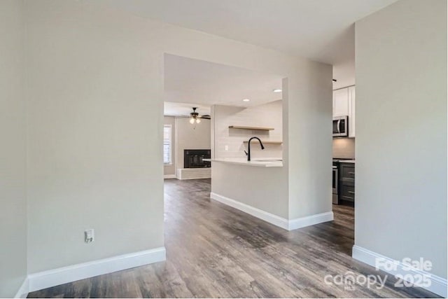 2335 Brookview Ct, Rock Hill, SC 29732 - spare room featuring baseboards, a ceiling fan, and dark wood-type flooring