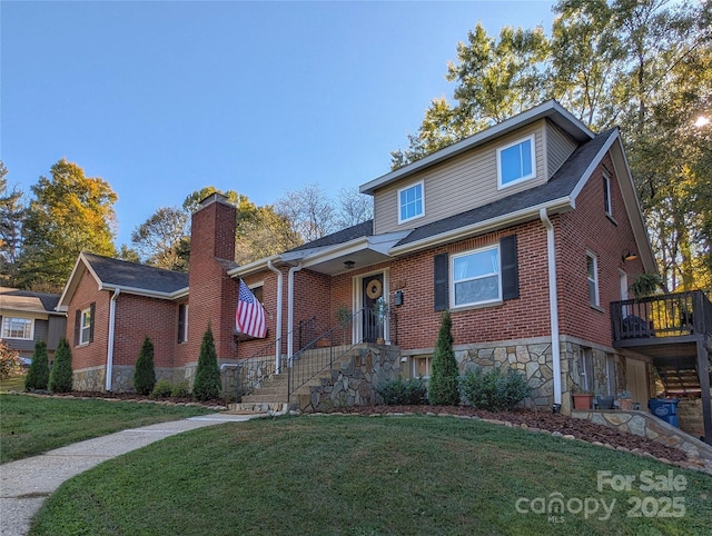 317 Balsam Dr, Waynesville, NC 28786 - view of front of home with roof with shingles, stone siding, a front lawn, brick siding, and a chimney