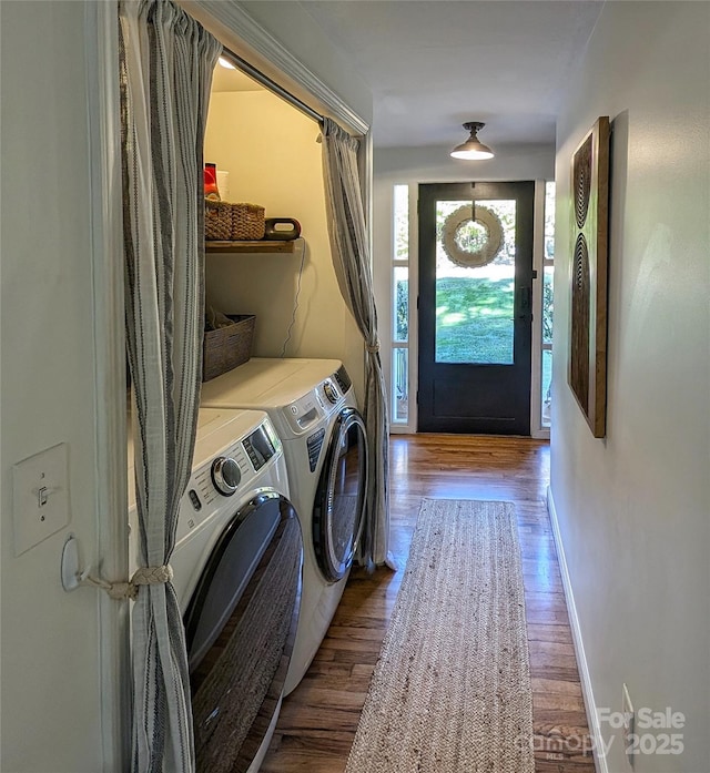 317 Balsam Dr, Waynesville, NC 28786 - washroom with baseboards, wood finished floors, washing machine and dryer, and laundry area
