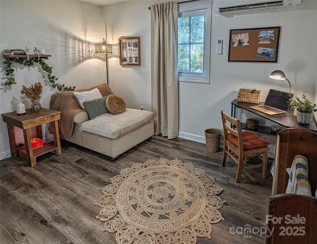 317 Balsam Dr, Waynesville, NC 28786 - sitting room featuring a wall mounted AC, wood finished floors, and baseboards