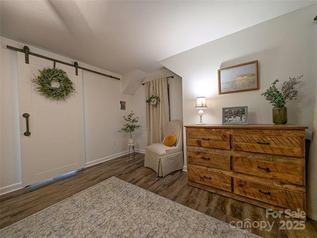 317 Balsam Dr, Waynesville, NC 28786 - living area with wood finished floors, baseboards, and a barn door