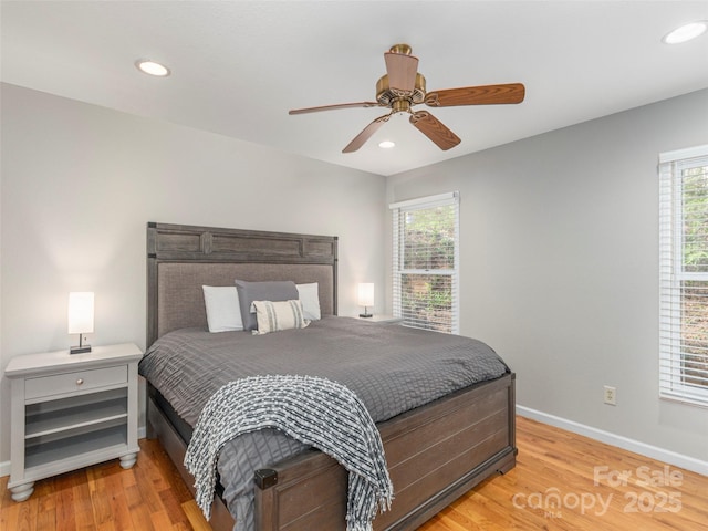 bedroom with light wood-style floors, baseboards, a ceiling fan, and recessed lighting