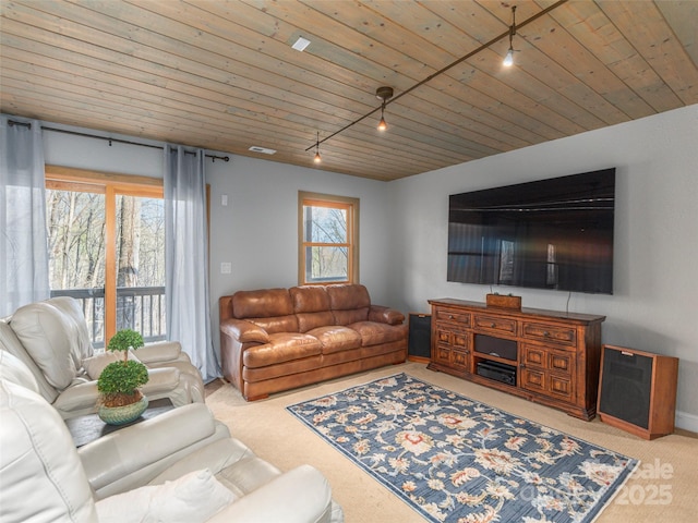 living room featuring track lighting, visible vents, wooden ceiling, and carpet floors