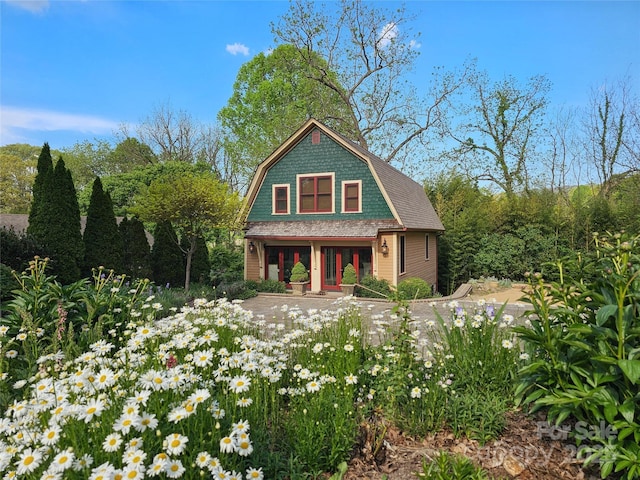 129 Woolsey Hts, Waynesville, NC 28786 - view of front of house featuring a porch and a gambrel roof