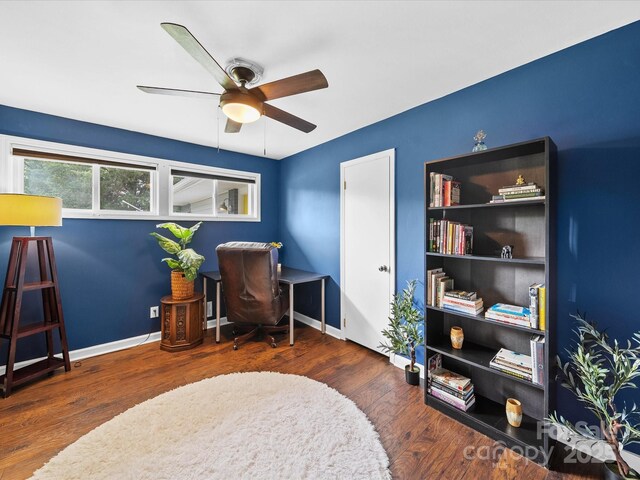 office area featuring baseboards, wood finished floors, and ceiling fan