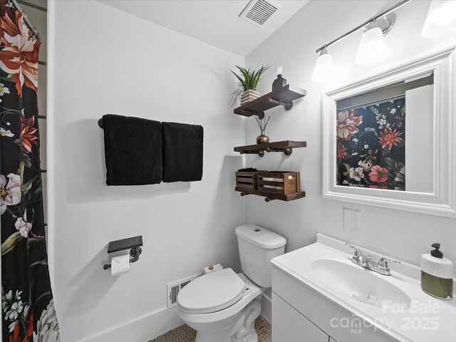 full bath featuring toilet, tile patterned flooring, visible vents, and vanity