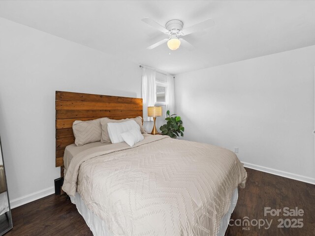 bedroom with wood finished floors, baseboards, and a ceiling fan