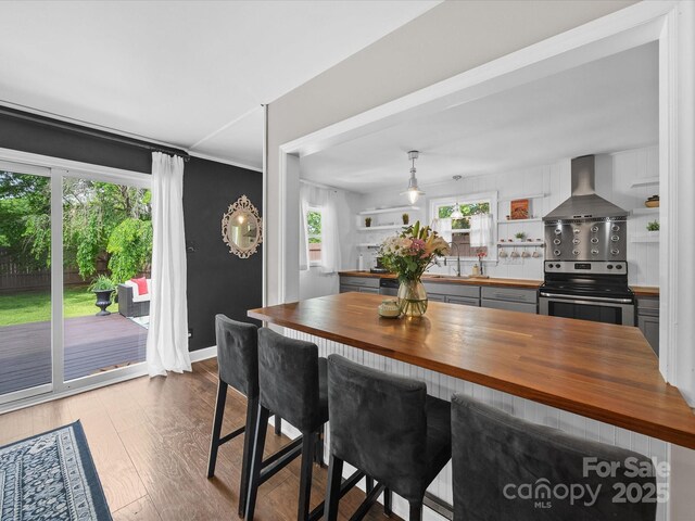 dining room featuring wood finished floors and baseboards