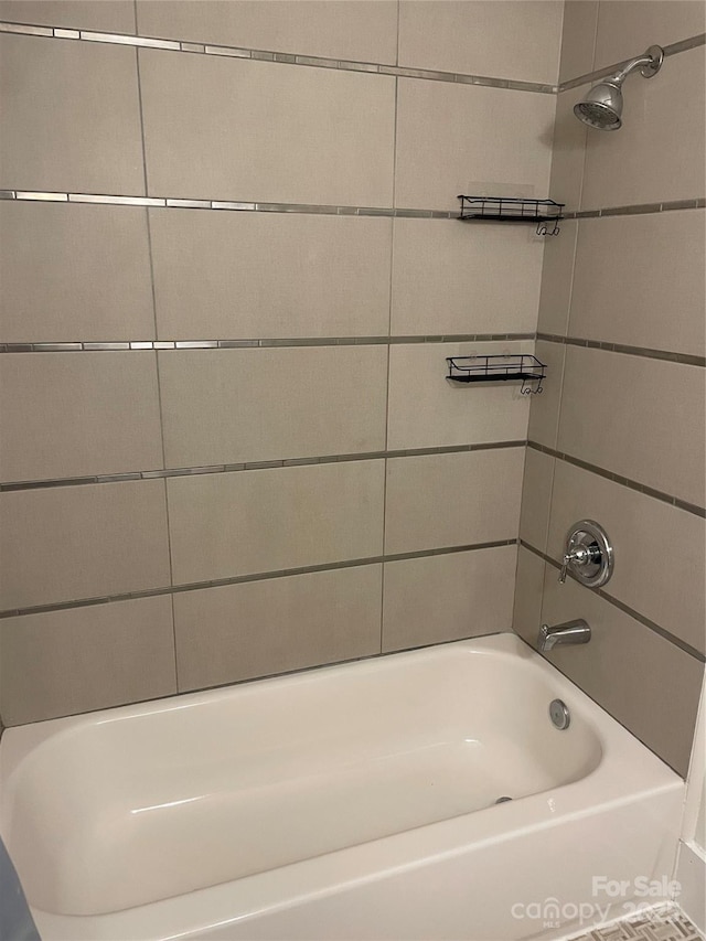 bathroom featuring washtub / shower combination