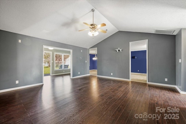 unfurnished living room featuring visible vents, vaulted ceiling, wood finished floors, and ceiling fan