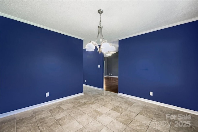 empty room featuring a chandelier, baseboards, a textured ceiling, and ornamental molding