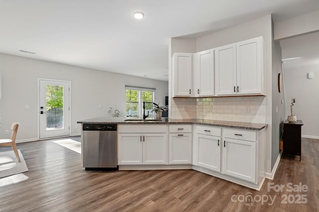 11040 E Lake Rd, Charlotte, NC 28215 - kitchen featuring white cabinets, stainless steel dishwasher, and wood finished floors